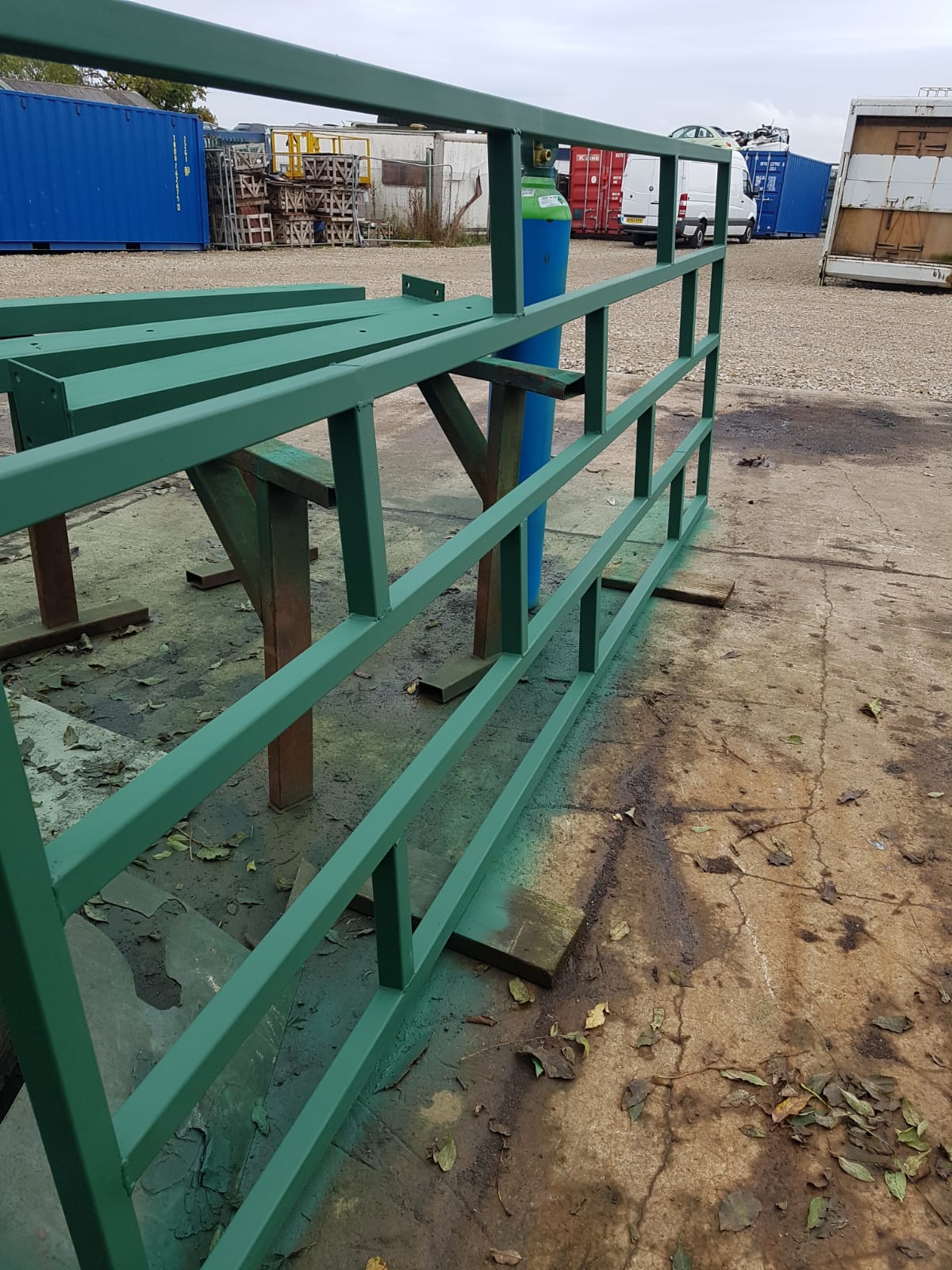 Green painted steel railing sections