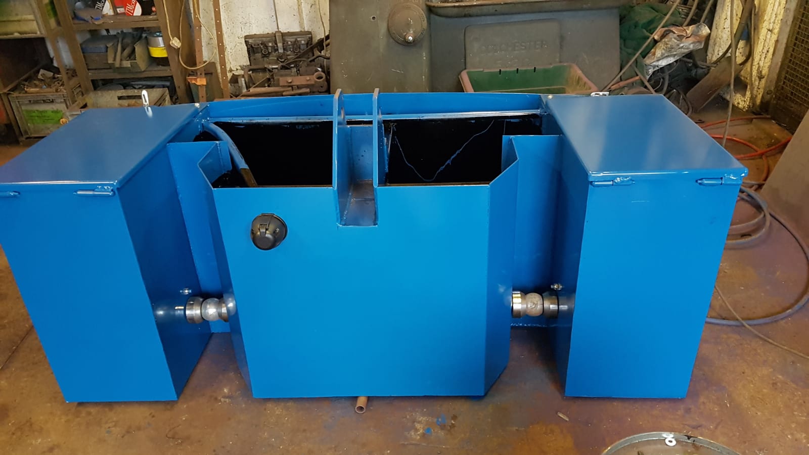 Blue fabricated steel tank with valves