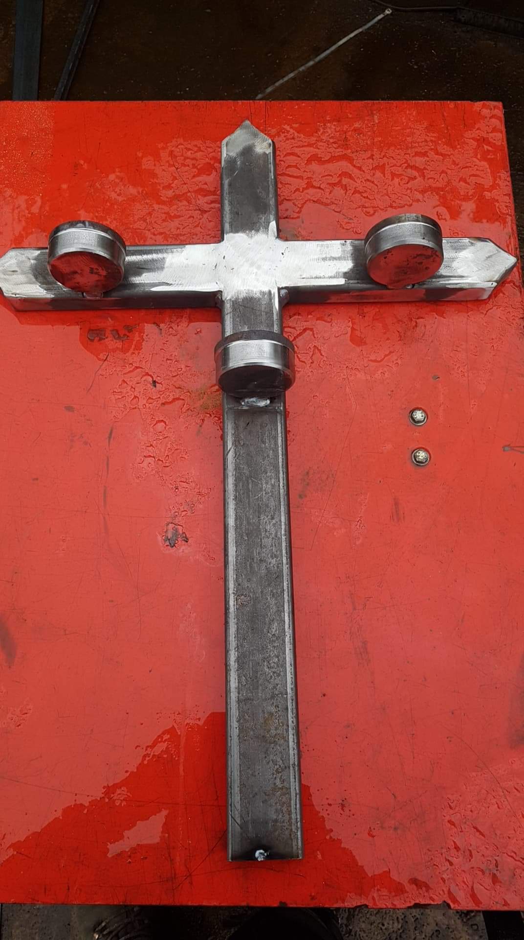 Metal cross with candle holders